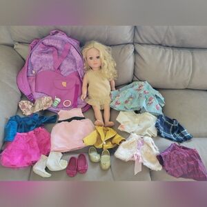 18 inch doll, carrying backpack, and clothes